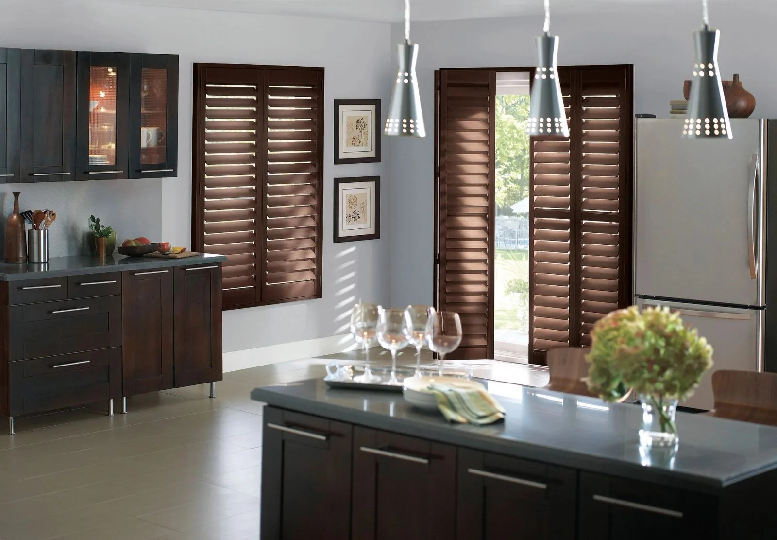 Wood shutters with bi-fold hinge and track system in kitchen on window and door