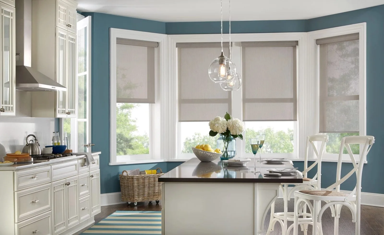 Motorized roller shades in kitchen