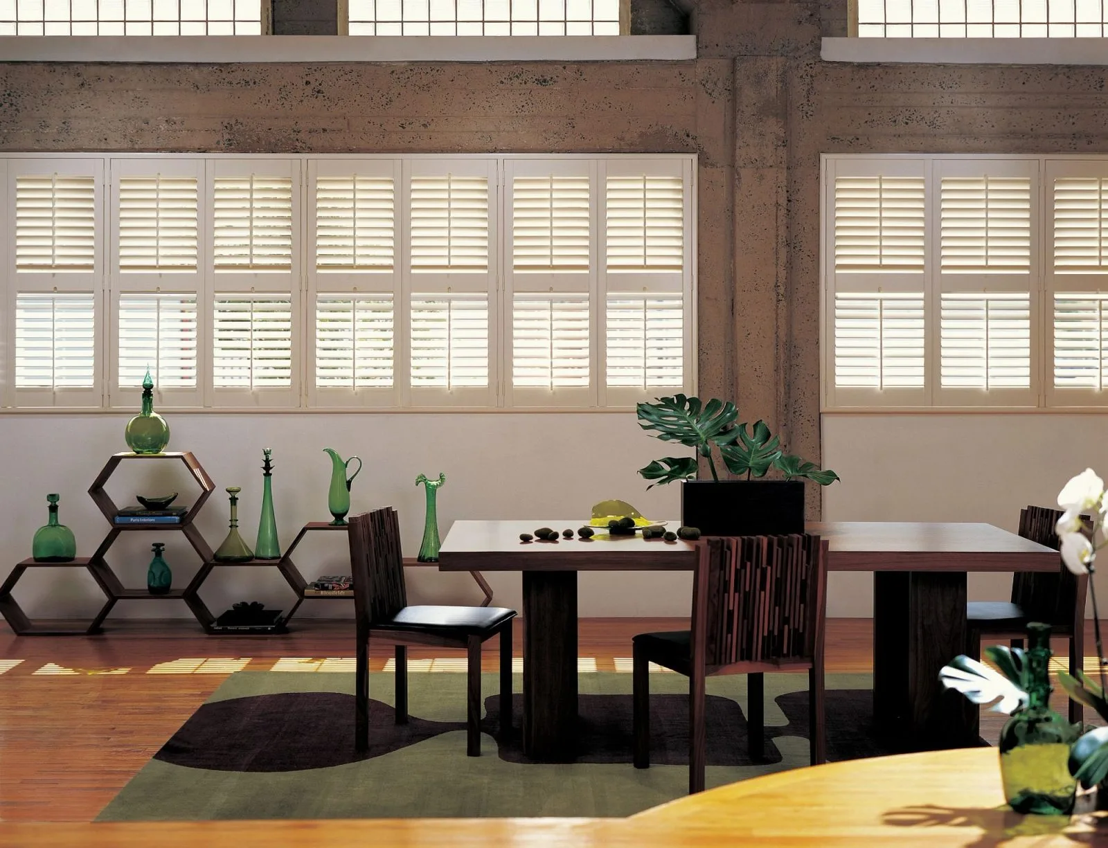 Composite plantation shutters with front tilt bar in long room