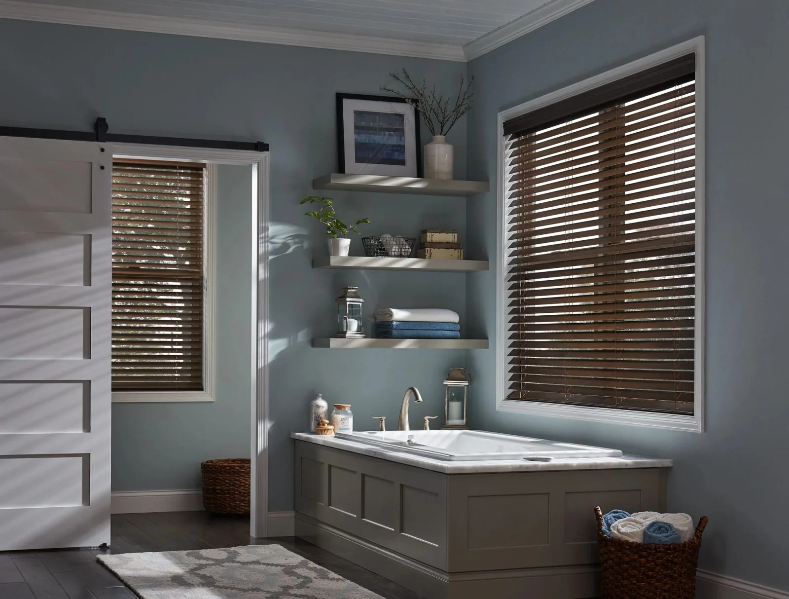 Motorized faux wood blinds with natural wood finish in bathroom